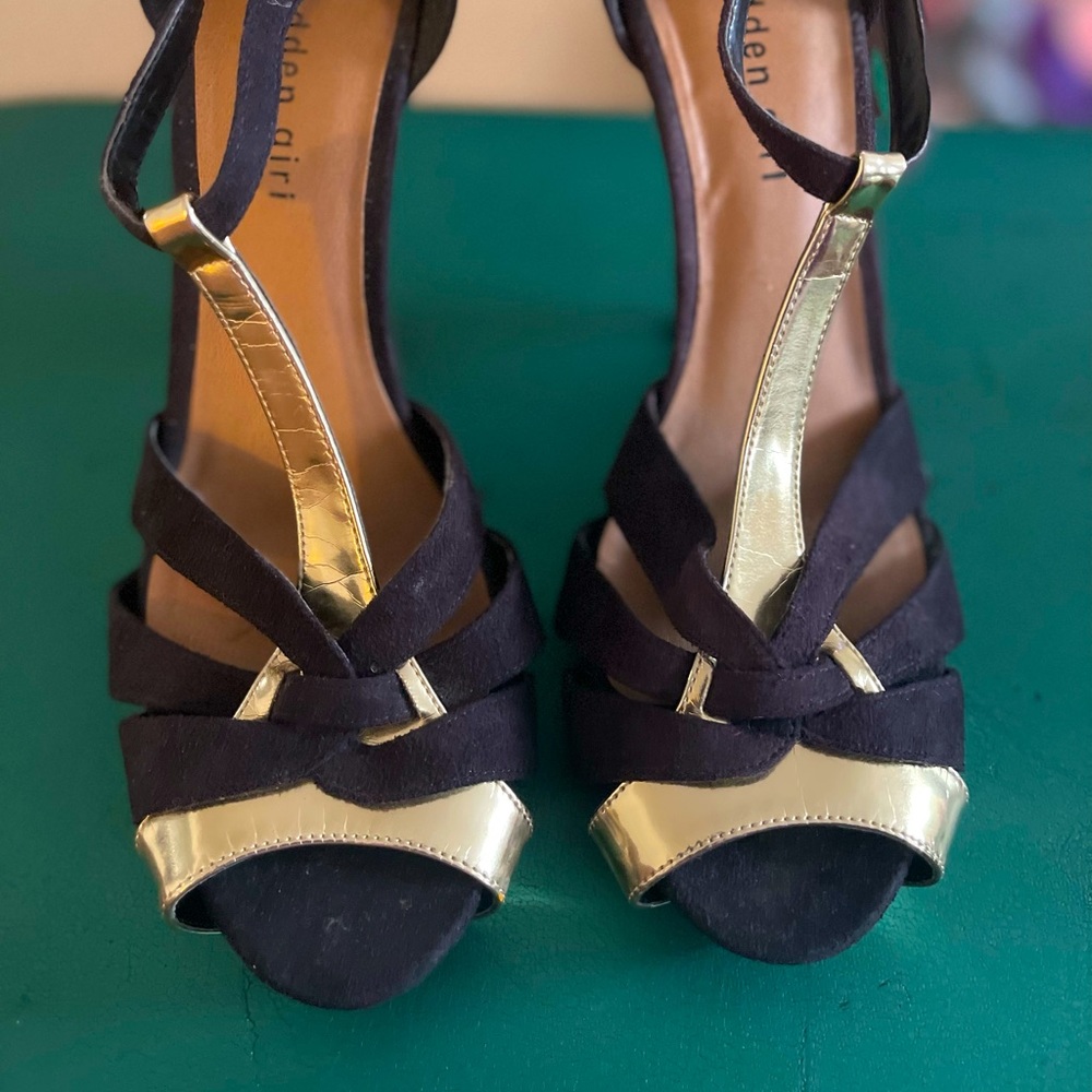 Black and gold sandal.